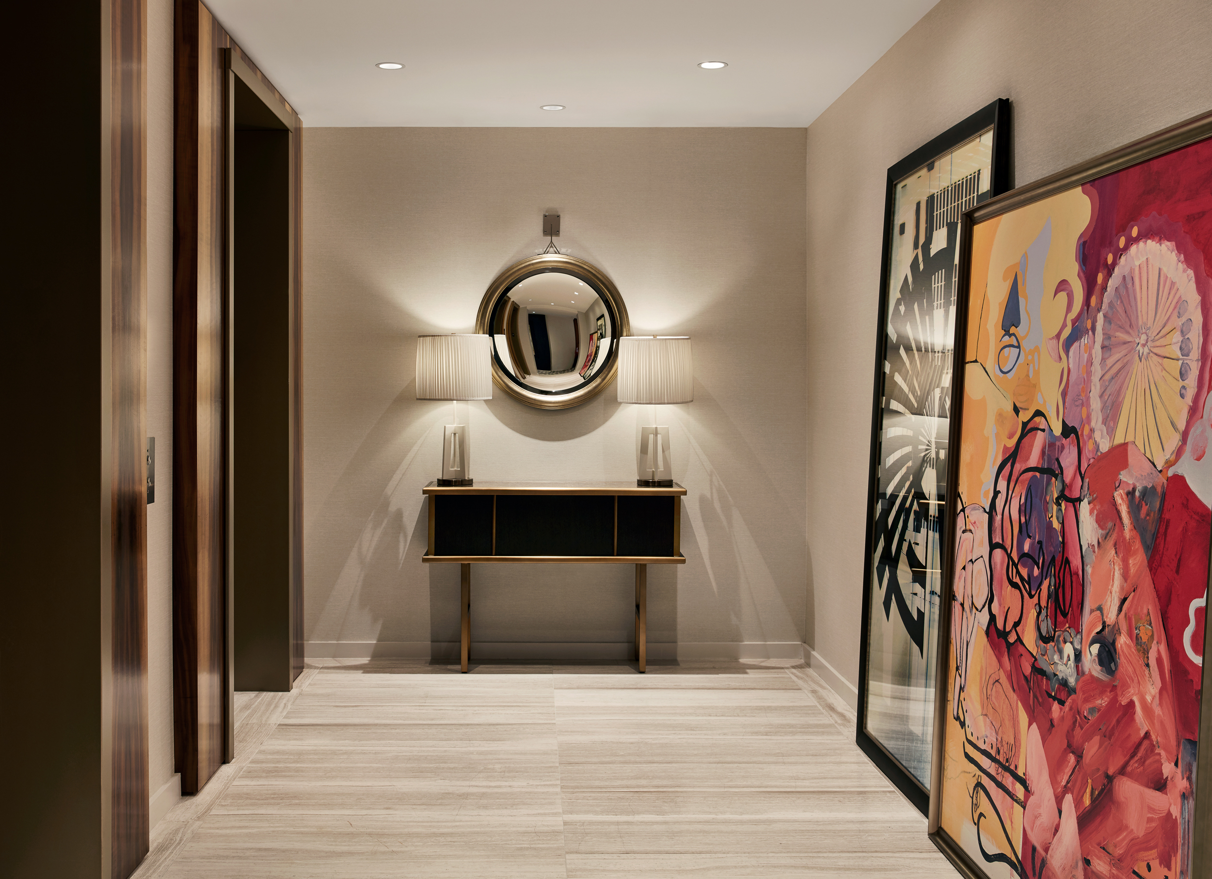 Mirror and end table near the elevators at Sophy